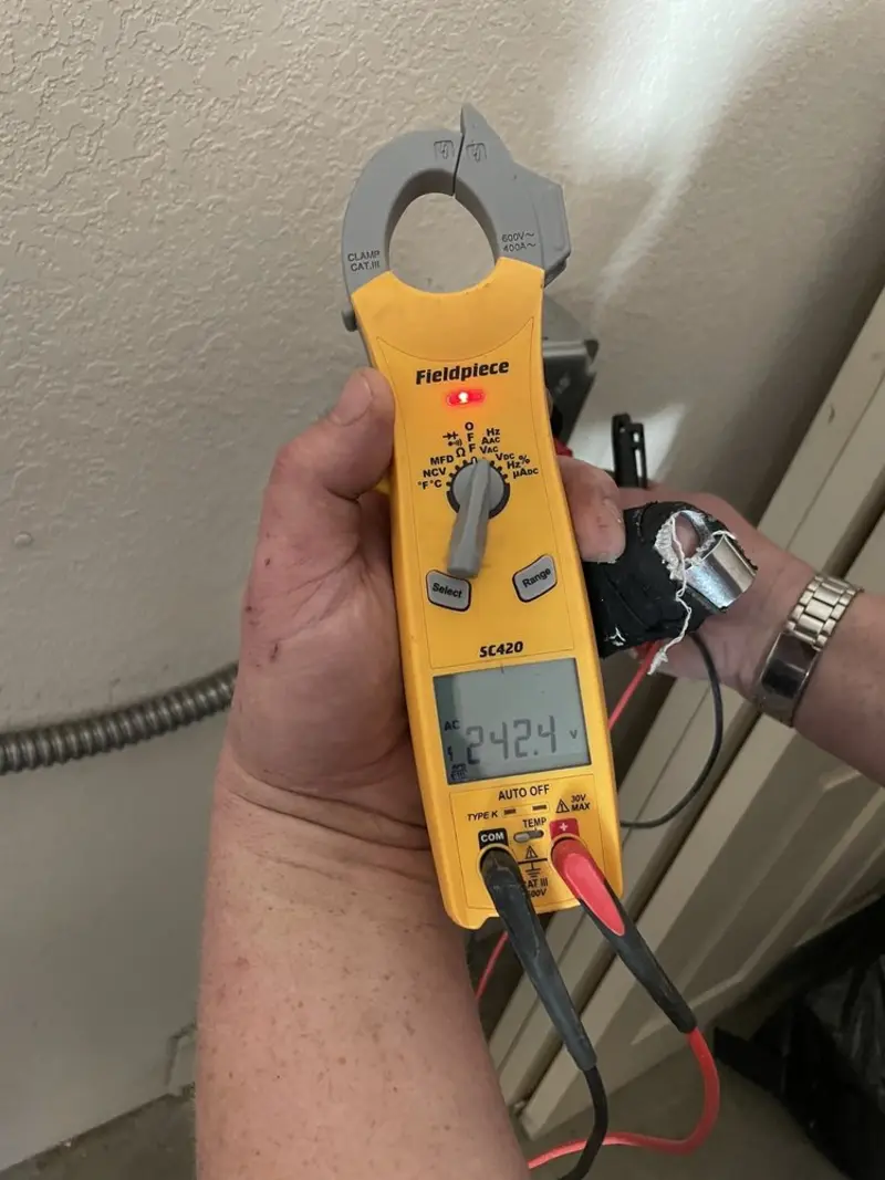 Voltage testing with clamp meter during Electrical Installation Services in Mount Holly
